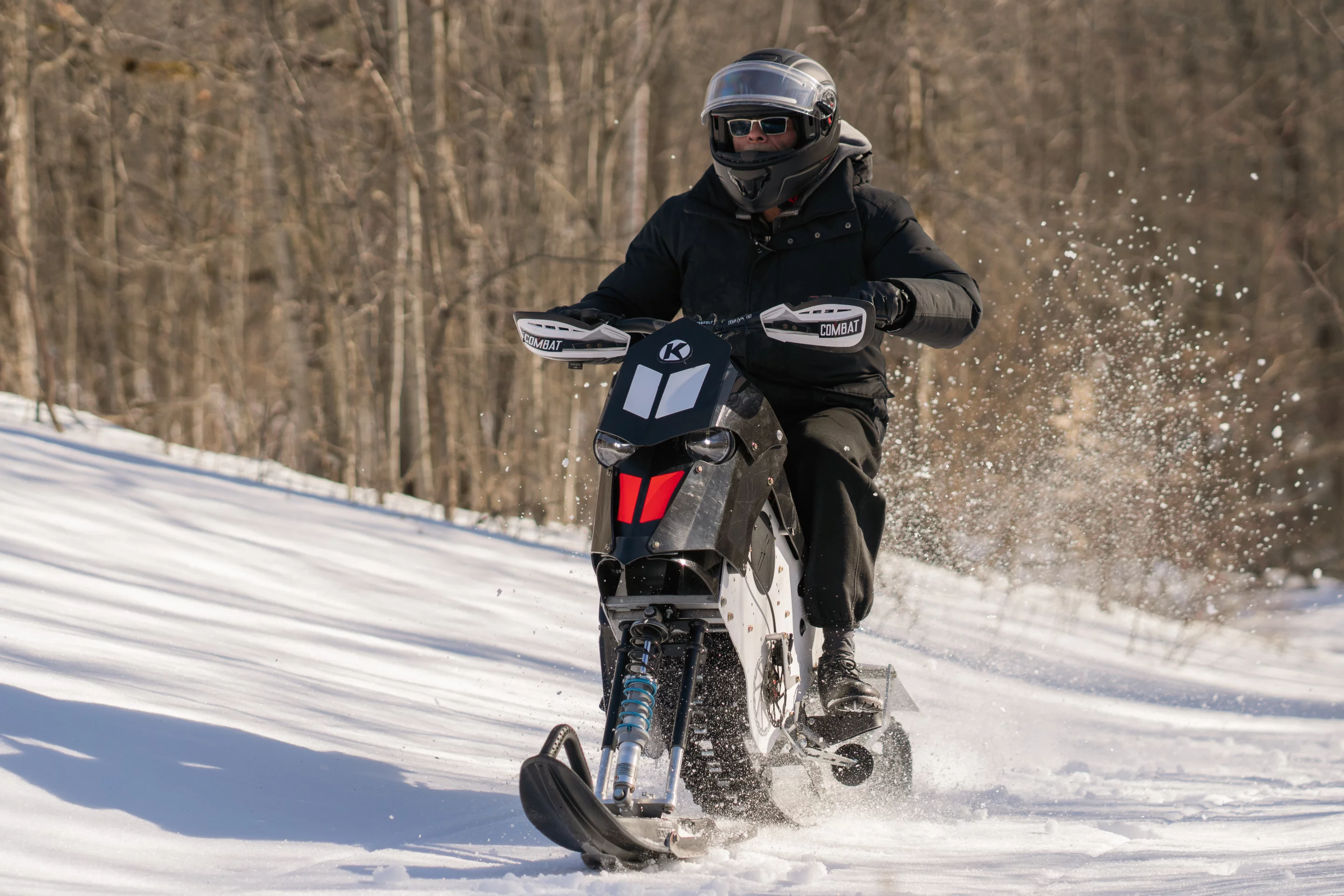 The Combat Ebike has a top speed of 70 km/h (44 mph) – presumably in both dirt and snow modes