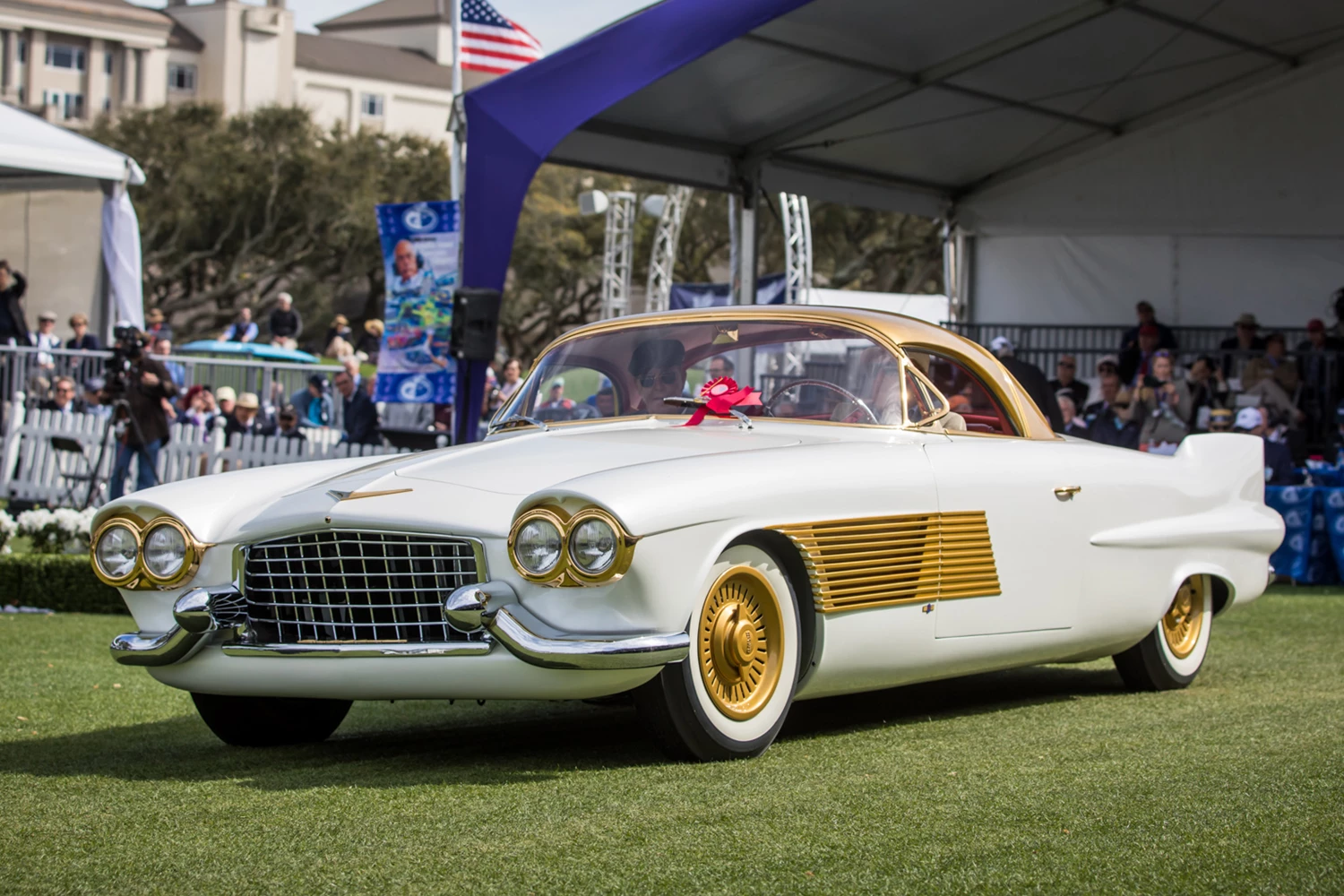 This futuristic, airplane-inspired two-seat retractable hardtop was the dream of Harry Birdsall in the 1950s. After acquiring a 1953 Series 62 Cadillac convertible that had been damaged by fire at a local dealership, Birdsall and his partner Joe Mascari commissioned Carrozzeria Rocco Motto to build their car. The chassis, drivetrain and drawings were shipped to Rocco Motto in Turin, Italy. It took 30 months to fabricate the hand-formed aluminum body and mount it to the 126-inch wheelbase chassis. The Cadillac is powered by the original 331 cubic inch 230 hp engine. All of the custom hardware pieces were fabricated in bronze and plated in 24 carat gold. An illuminated St. Christopher medal is built into the hub of the hand-made transparently rimmed steering wheel. The car features a unique retractable hard top. After Birdsall's death the car went to Mascari who later sold it. It passed through several owners and was damaged by Hurricane Andrew. It was then acquired by the Birdsall family and restored in 2014.