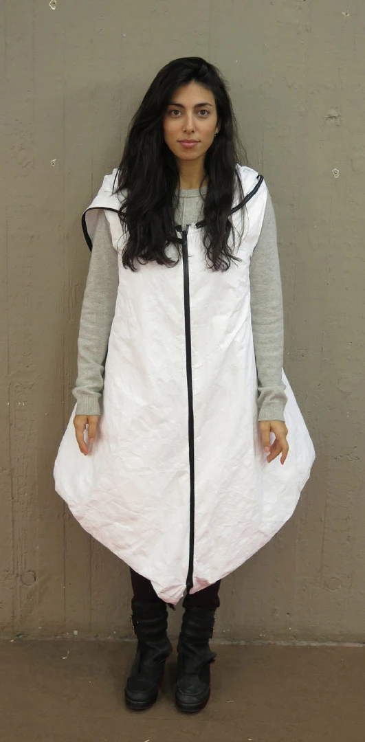 The wearable shelter is made of lightweight and weather-resistant materials Tyvek and Mylar