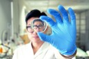 Shown here on an eyeglass lens, the thin film could also be applied to camera lenses