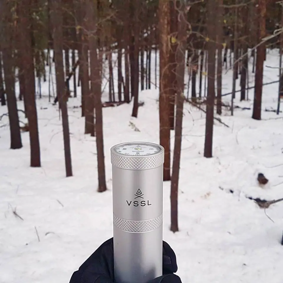 VSSL Supplies' latest survival flashlight/supply cache has a Suunto compass end cap
