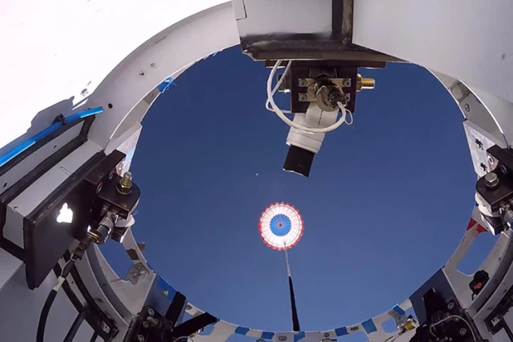 A drogue parachute is deployed from the Starliner's landing system