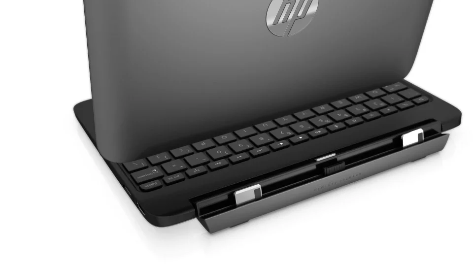 The tablet part of the two-in-one device attaches by a magnetic hinge to the keyboard base