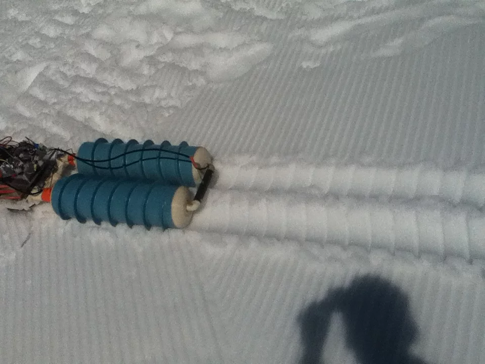 The screws propel the snowboard forward