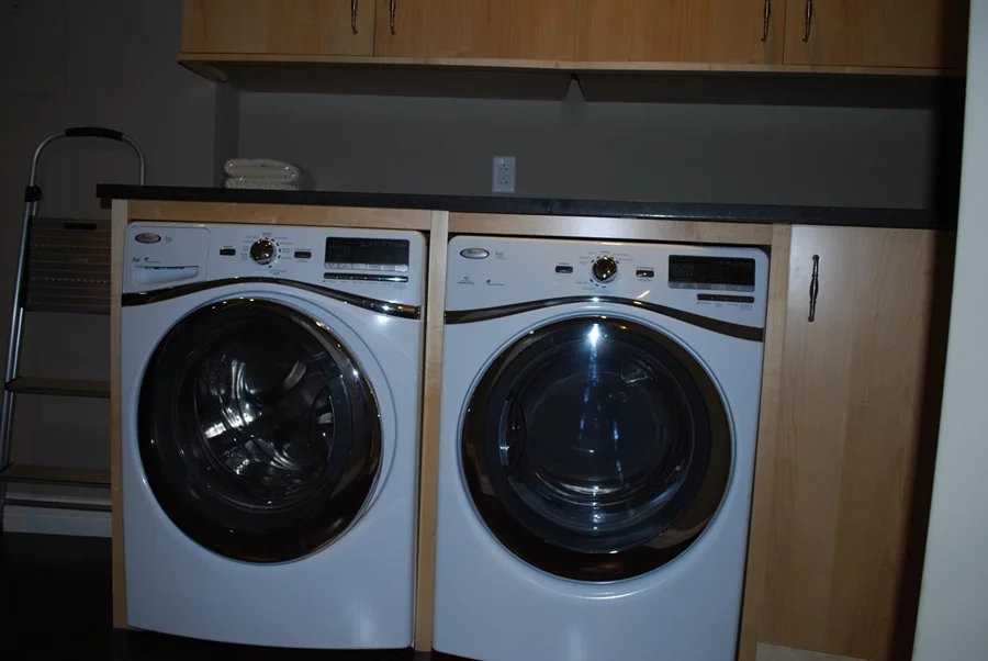 A washing machine and drier in one of the shelter condos