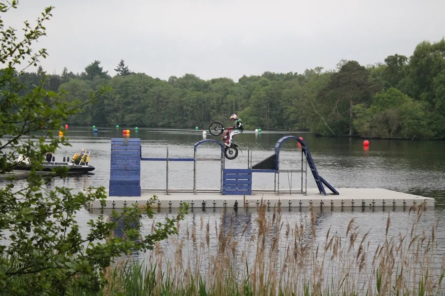 Dougie Lampkin performing on a floating course at Cholmondeley