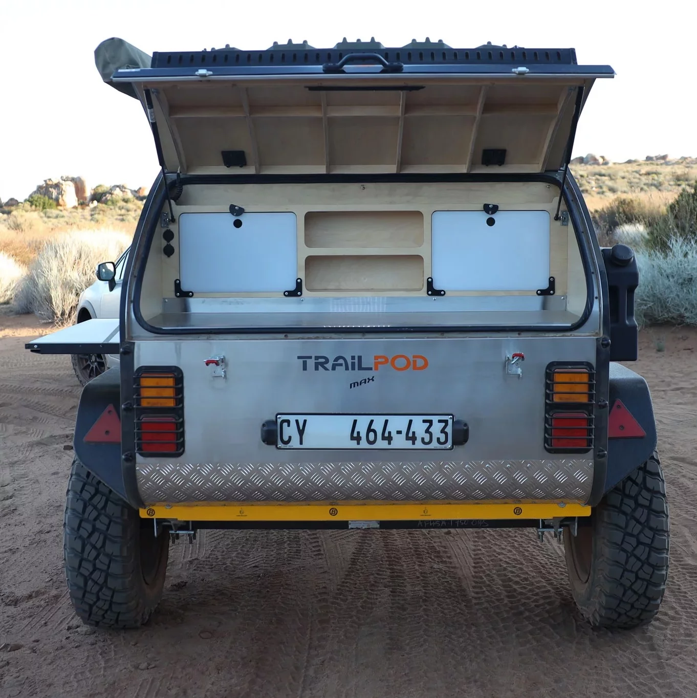 The Trailpod Max brings a simple but functional tailgate galley paired with a fold-down side shelf