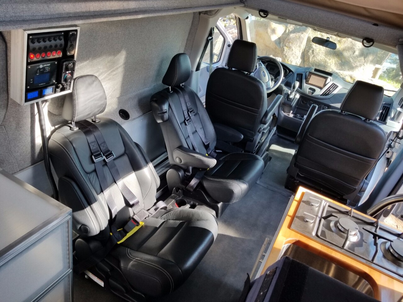 The middle seat is removed here but slides between the two rear captain's chairs, offering space for a child or small adult