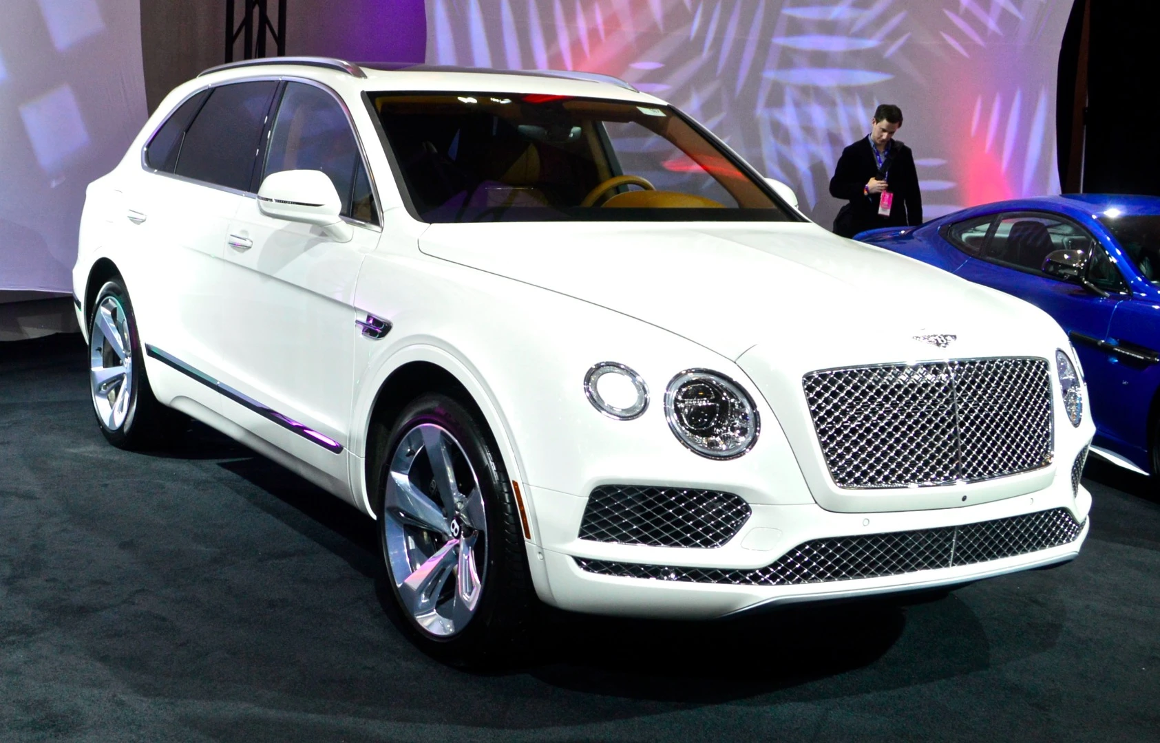 The Bentley Bentayga makes an appearance amongst the exotic machines outside the media room