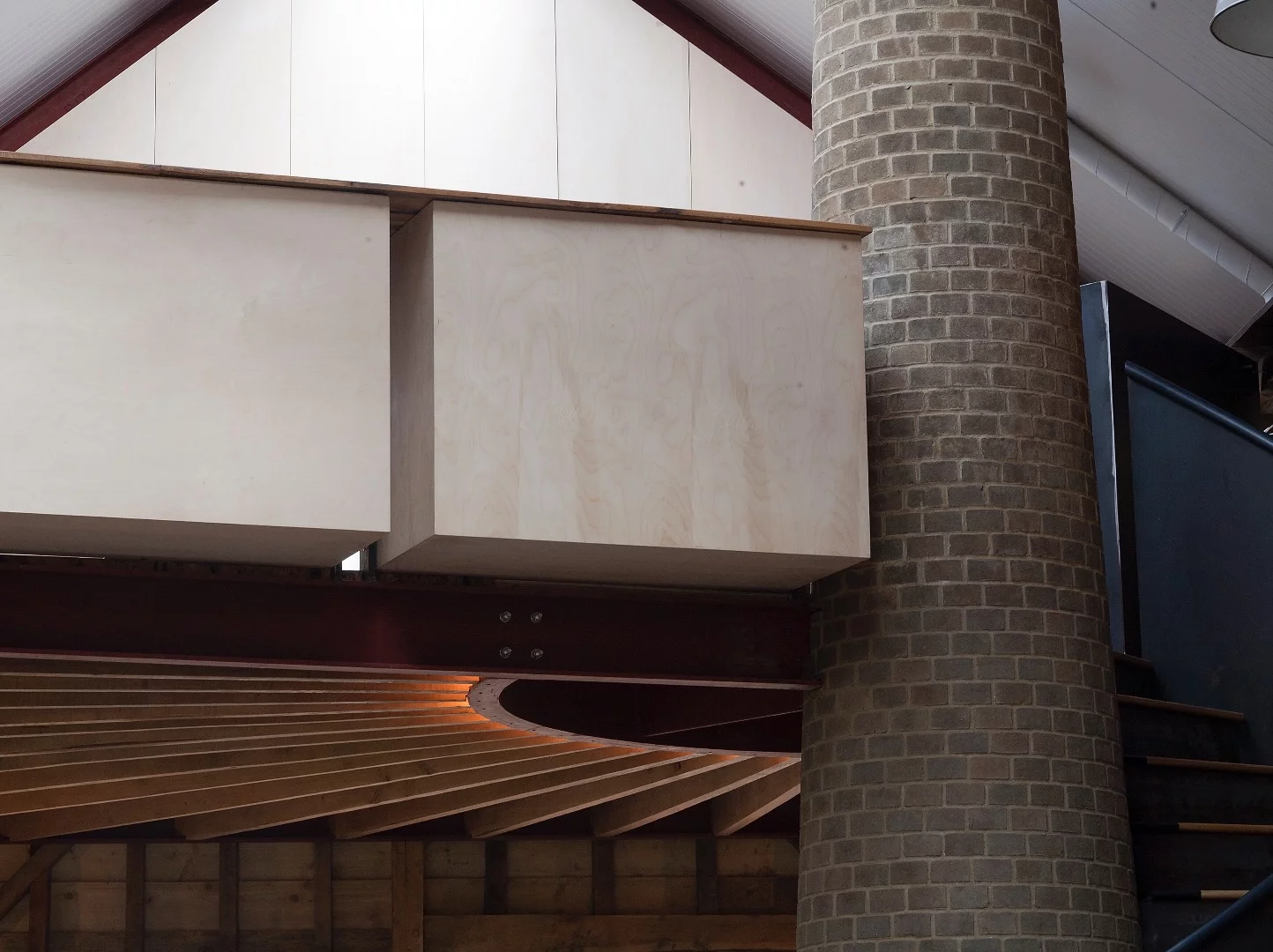 The mezzanine area and stone chimney