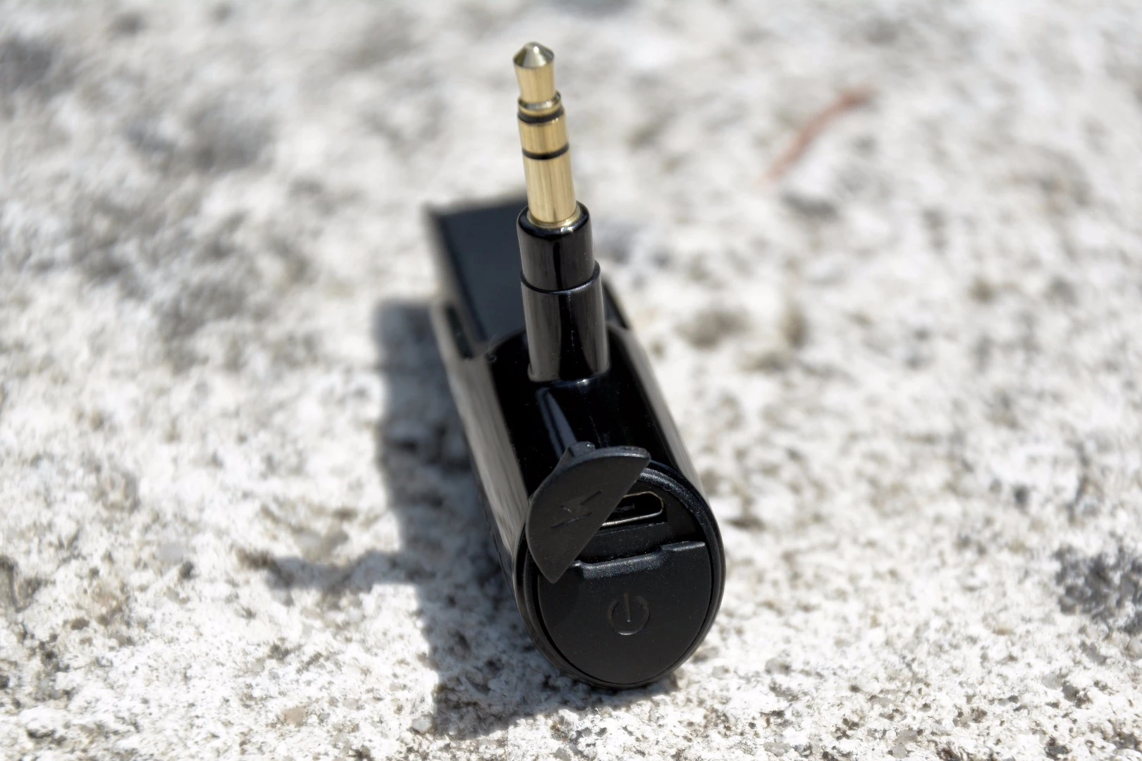 The USB charging port and multi-function button to the rear of the BTunes plug