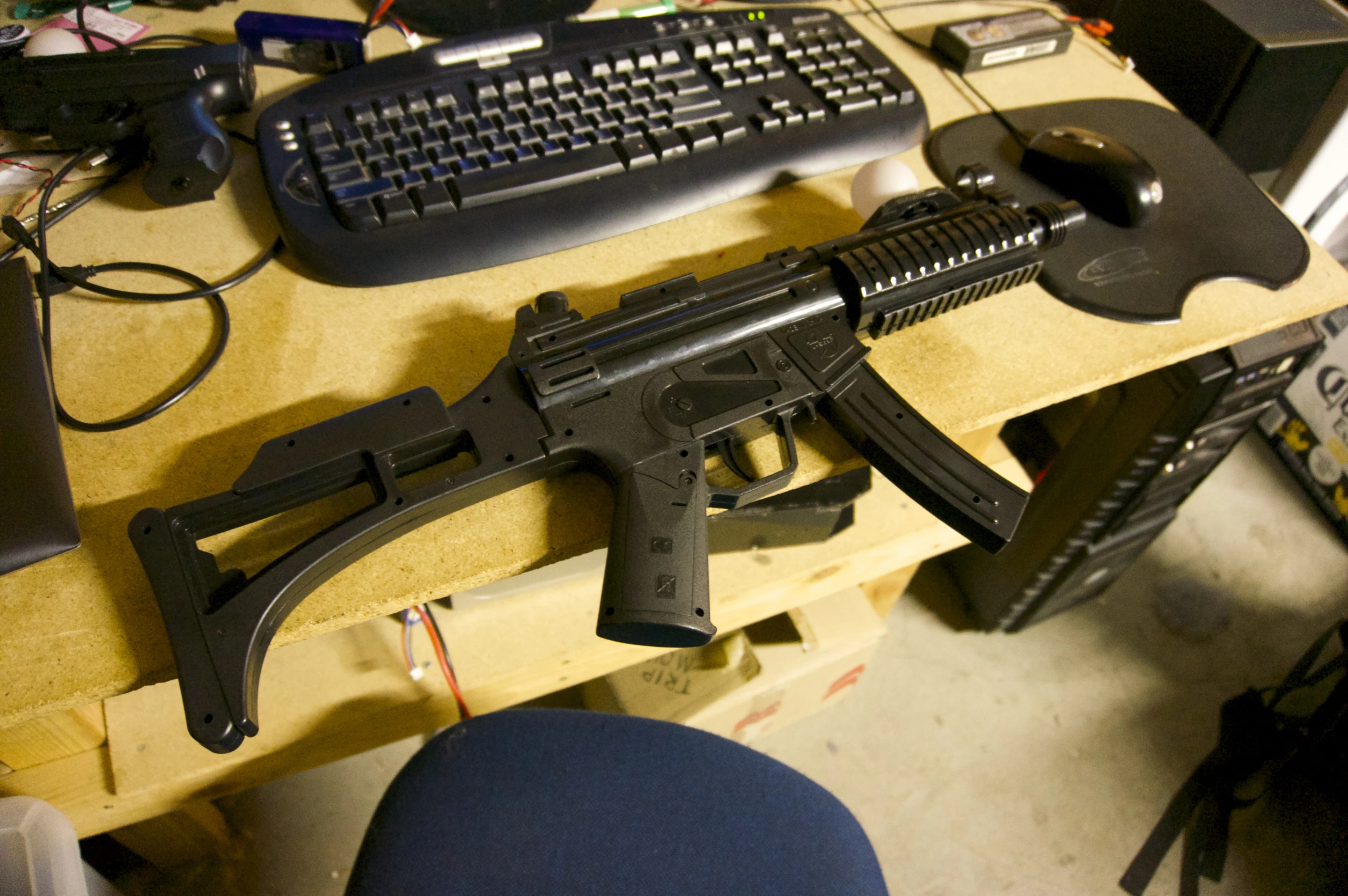 They've created two different kinds of plastic gun controller – this rifle, which has a reload button on the magazine, and a handgun