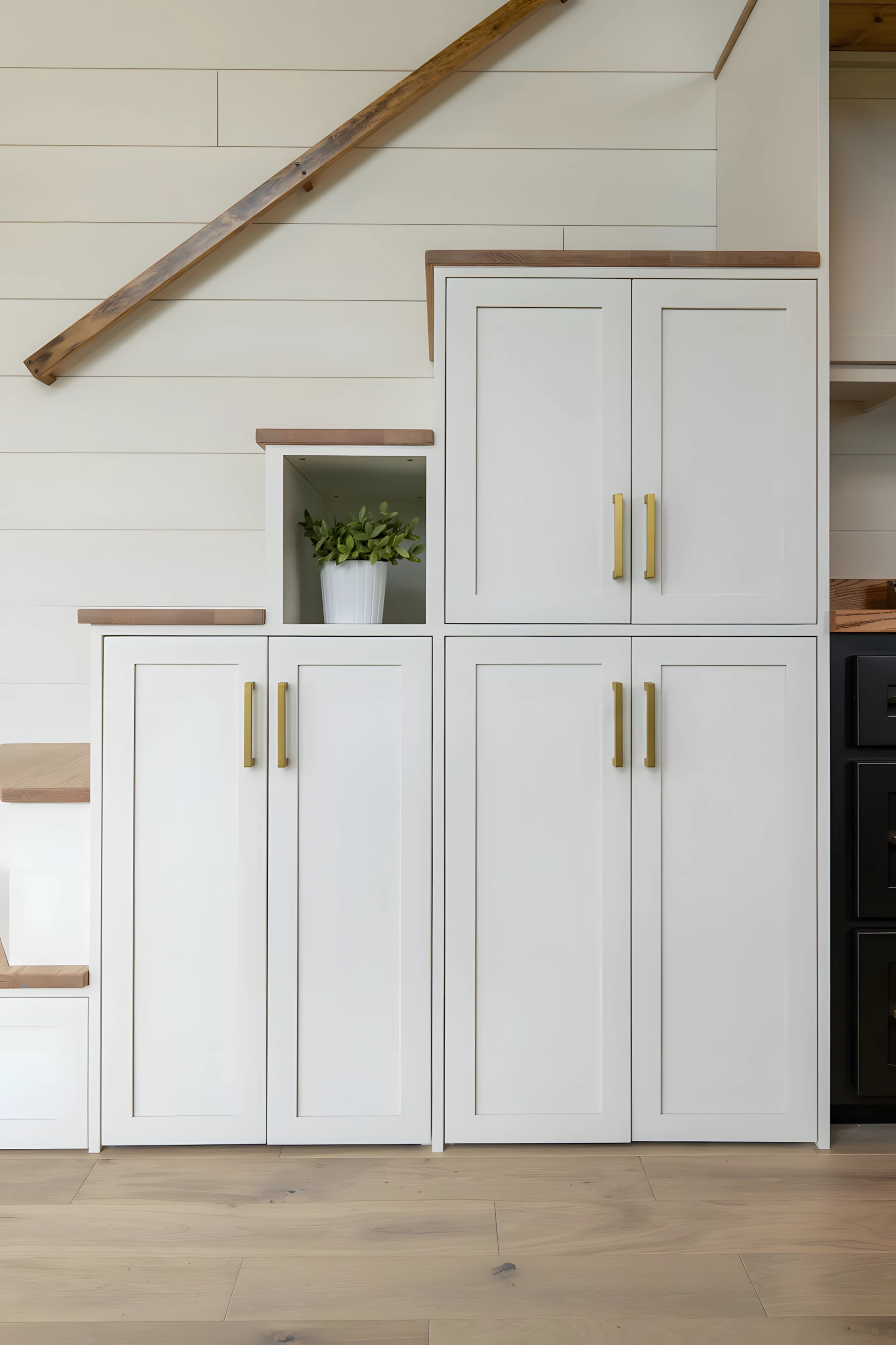 The Rutledge's upstairs bedroom is reached by storage-integrated staircase, as shown, or ladder