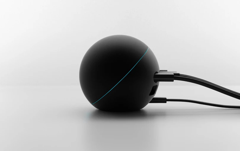 The Nexus Q hooked up to a couple of speakers and HDTV via HDMI