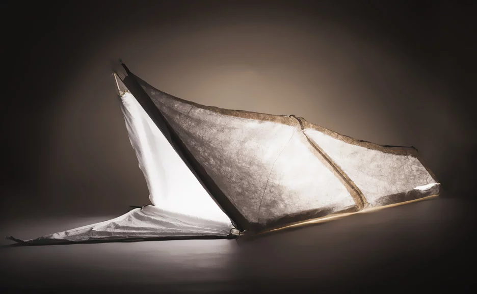 The jacket can be converted to a tent by inserting lightweight kite poles