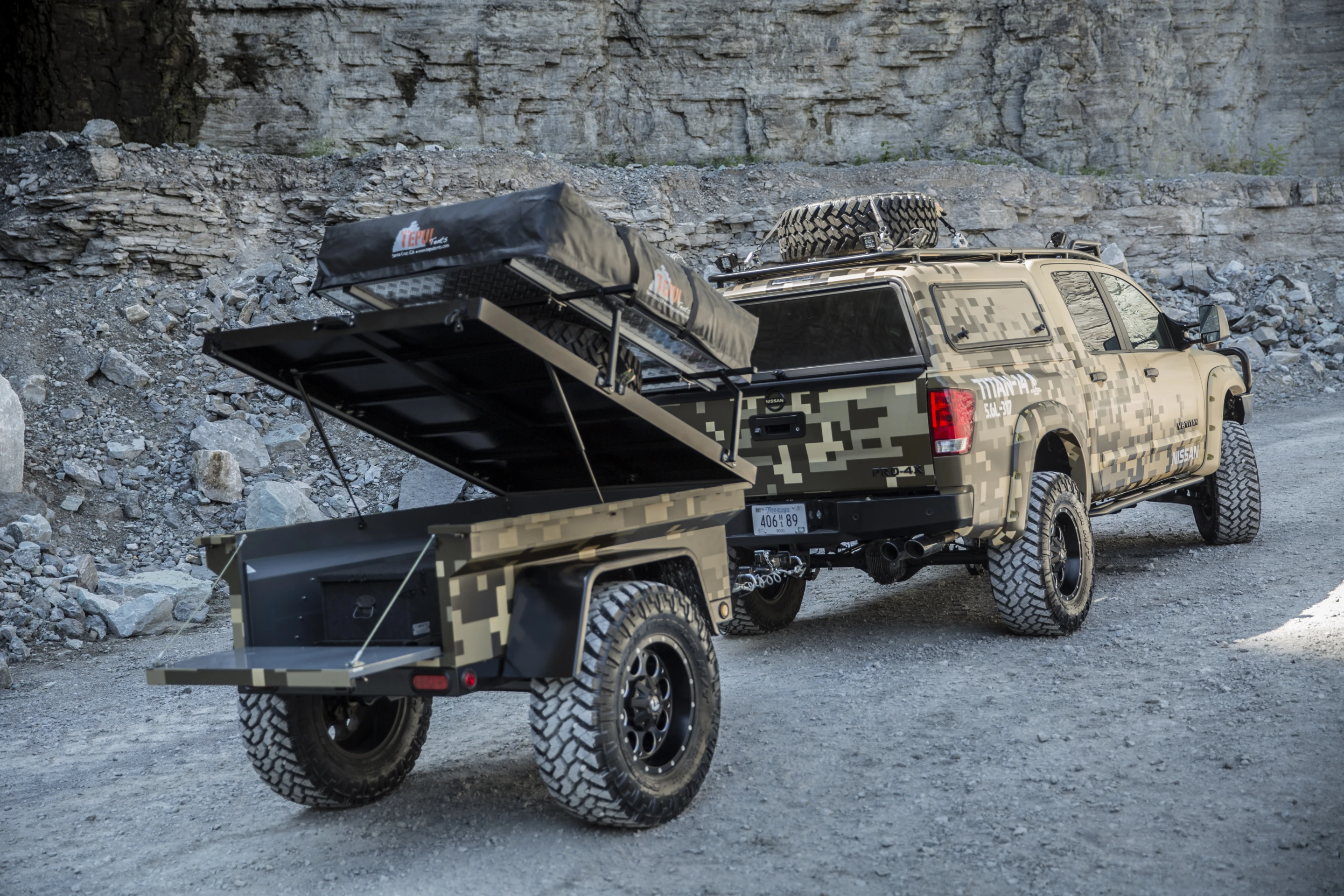 The Project Titan truck pulls a custom camping trailer along with it