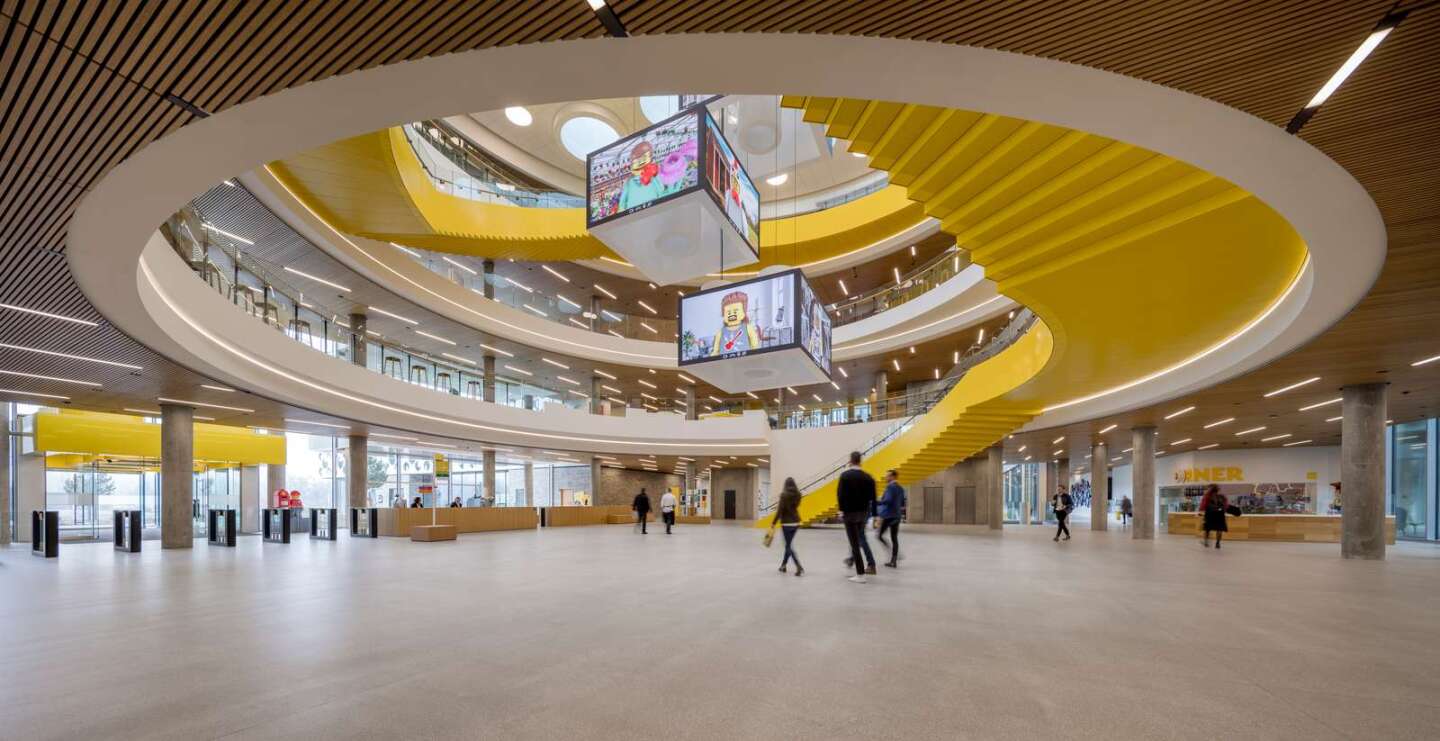 The Lego Campus' interior is arranged around a large naturally lit atrium that has oversized Lego bricks hanging down from the ceiling