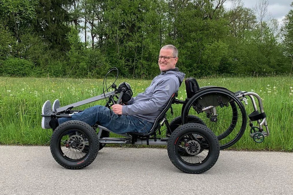 The rider can carry their wheelchair on the back of the vehicle