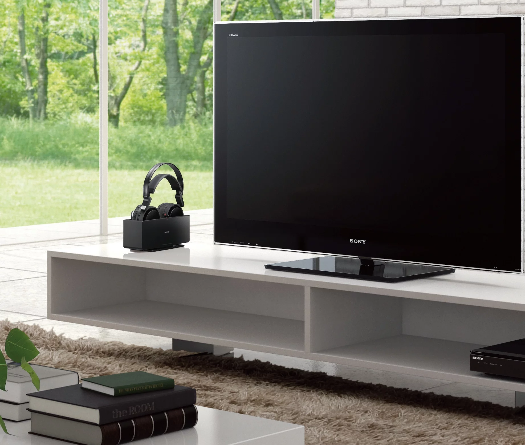 The Sony MDR-RF4000K wireless headphones in their charging station don't look out of place next to modern TVs