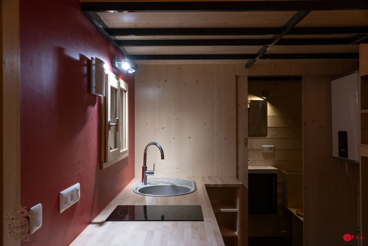 The Axelle's kitchen includes a two-burner hob, sink, oven, and storage space