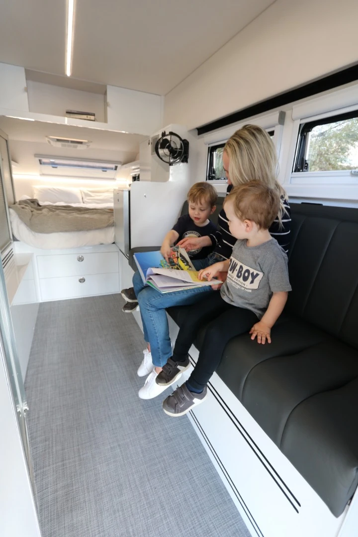 The sofa lounge offers a place to relax and eat before transforming into a pair of bunk beds