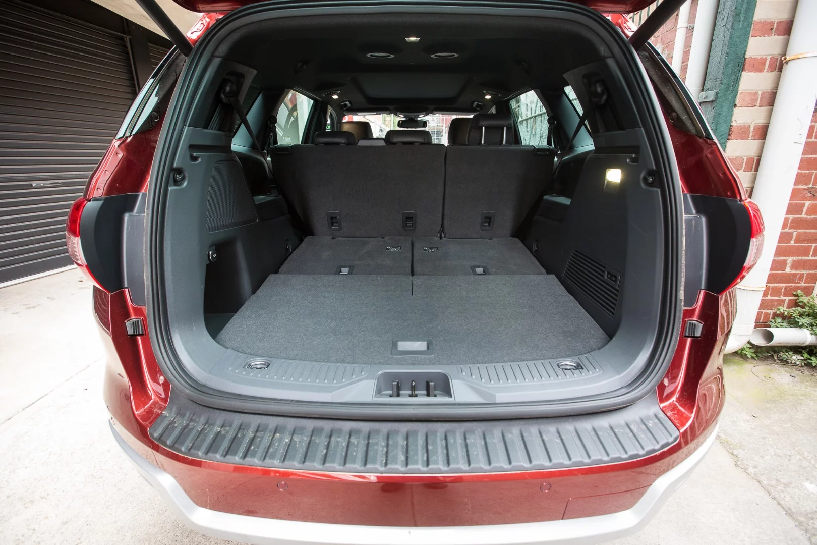 Further back in the cabin there's plenty of cargo room helped by the fact that the power-folding third row of seats fold flat to the floor,