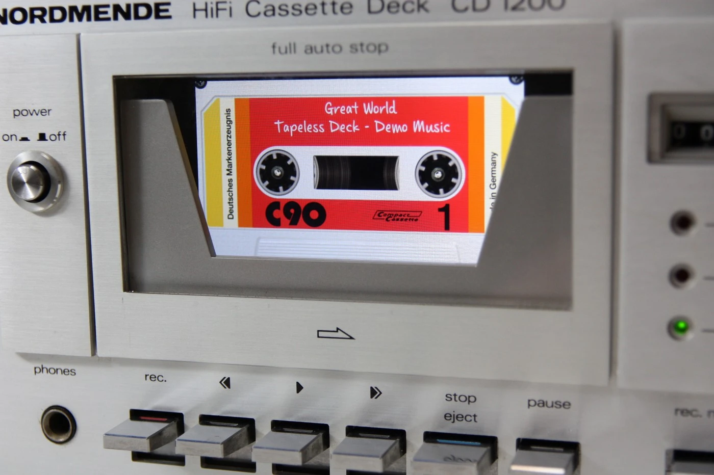 The app running on the smartphone mounted in the audio cassette drawer of the CD 1200 includes a cool-looking tape animation