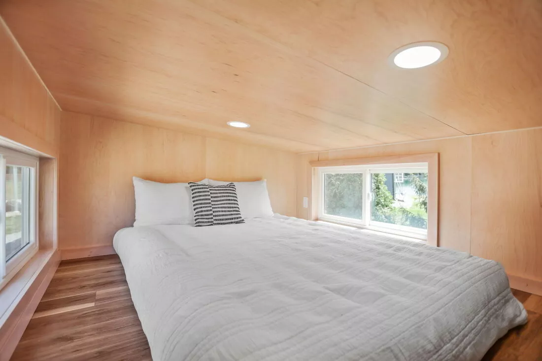 The Sea Chord's bedroom is a typical loft-style space with a low ceiling and a double bed