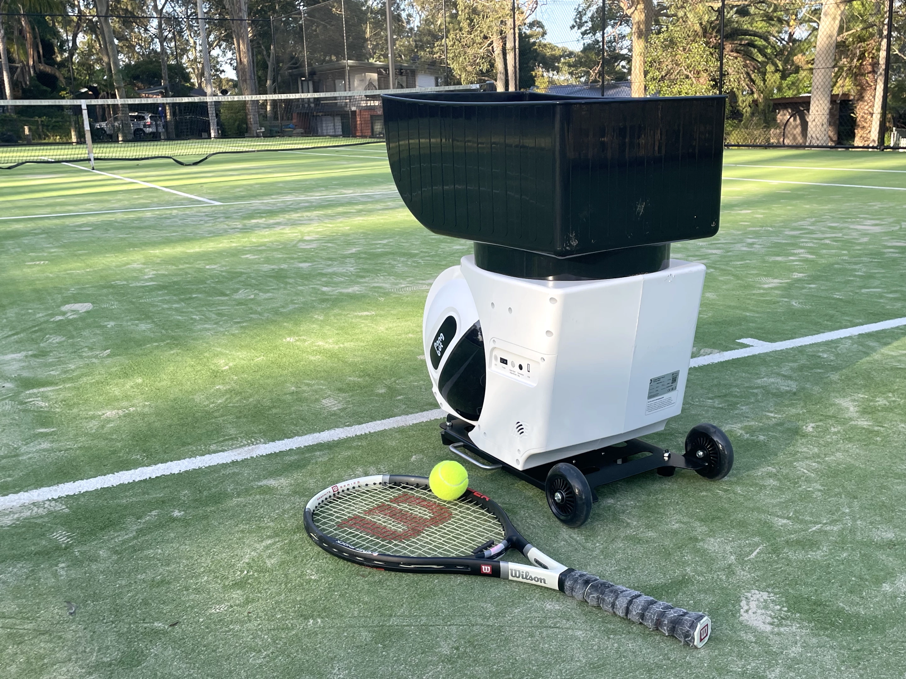 The machine stays stationary at the baseline while you do all the movement at the other end of the court
