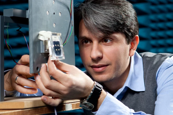 Onur Hamza Karabey and his prototype liquid crystal antenna