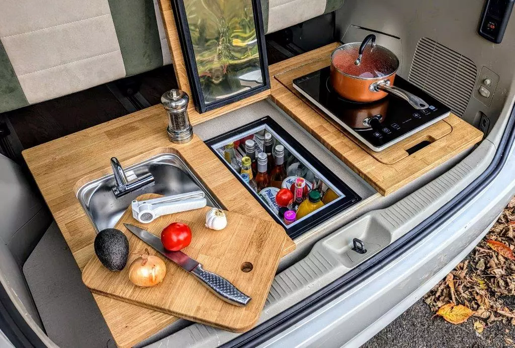 The compact, low-profile rear kitchen includes all the essentials, just slimmed down and dropped into the trunk