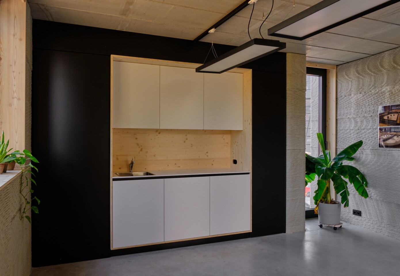 The 3D-printed house includes a simple kitchenette