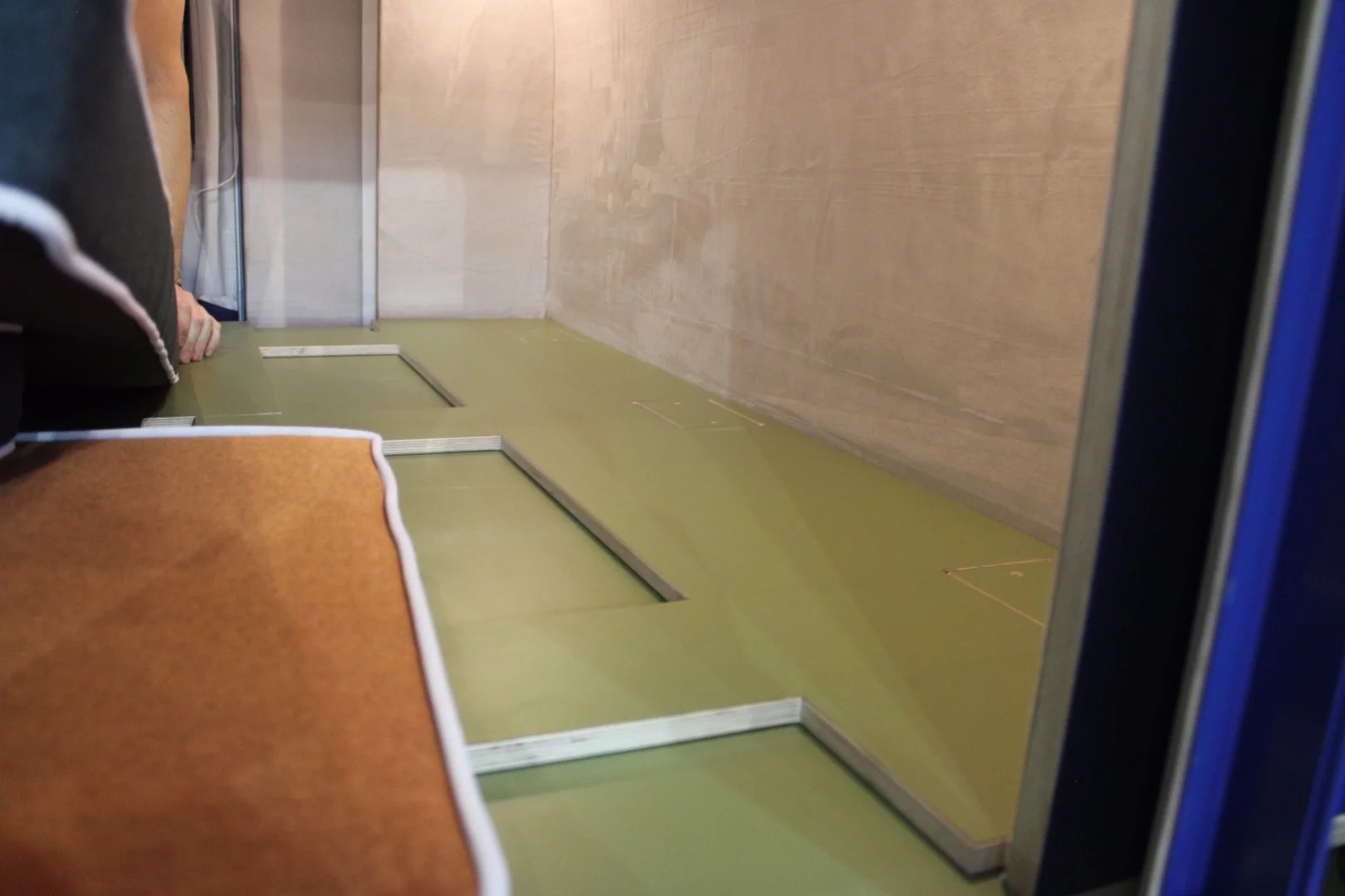 The back of the sofa folds flat and fits together with the bench frame like a puzzle when it's time to build the bed