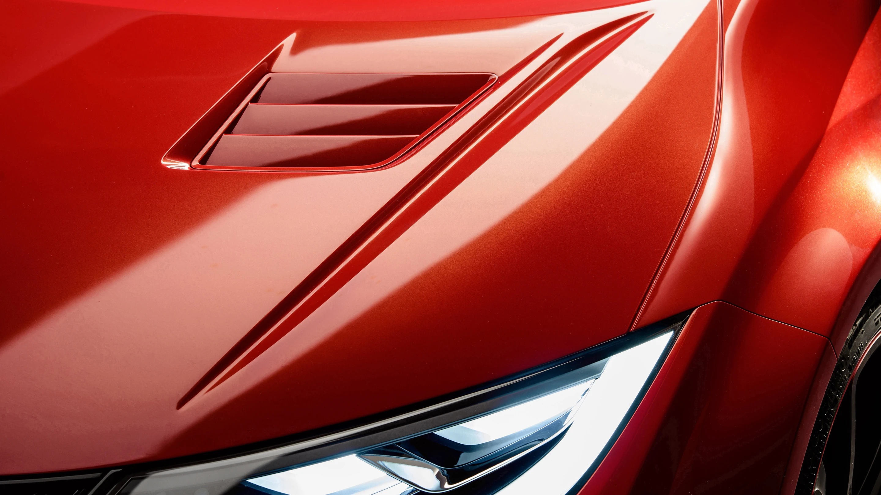 Air outlets on the hood and larger front grilles allow for better cooling of the engine
