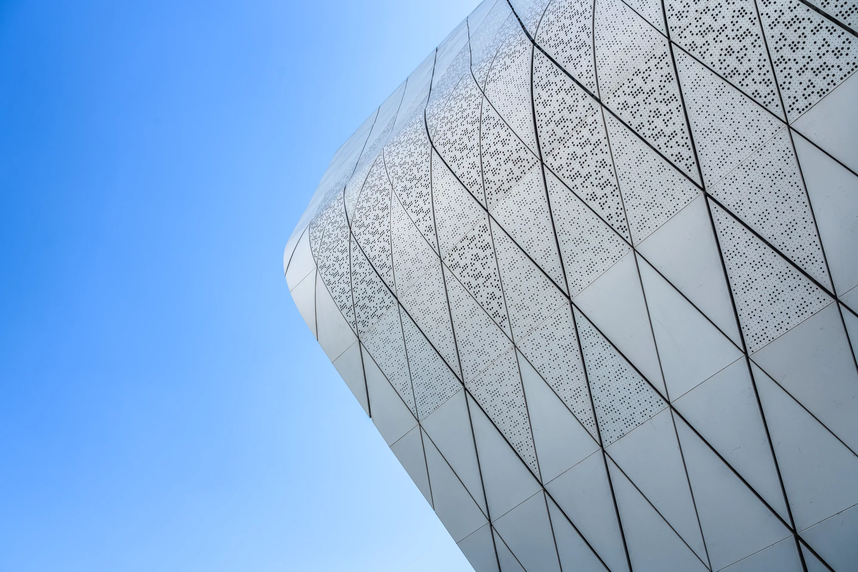 The National Maritime Museum of China's patterned exterior consists of 55,000 sq m (592,000 sq ft) of aluminum