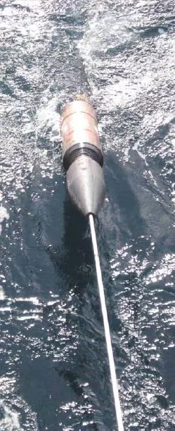 A repeater on a cable as it is spooled out into the ocean