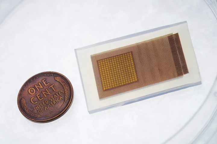The prototype ultrasound patch, with a penny for scale