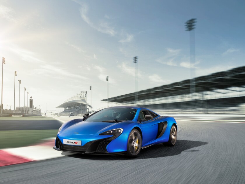 The 650S receives a new integrated front splitter that not only helps push the nose down but also redirects air to special door blades behind the front wheels to further increase downforce levels