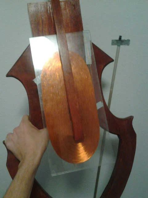 The huge coil between two sheets of plastic is mounted on the neck