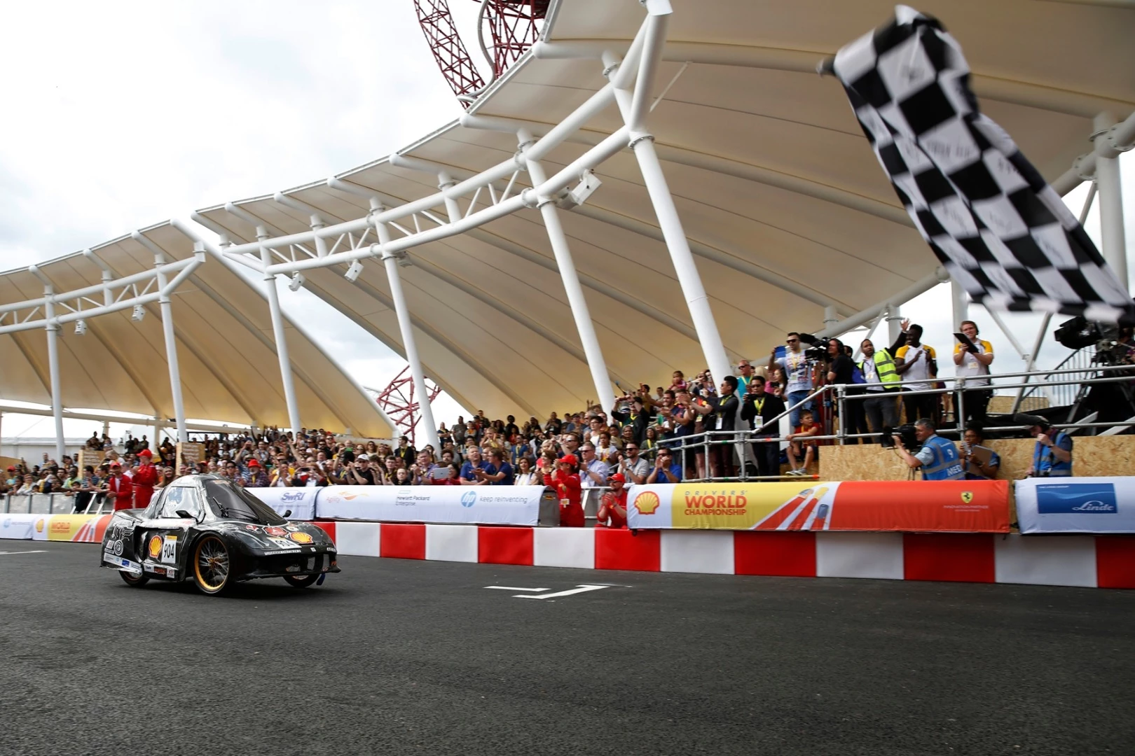 The TURANGGA CHETA EV3, a battery electric UrbanConcept racing for team BUMI SILIWANGI TEAM 4 from Universitas Pendidikan Indonesia, Bandung, Indonesia, prepares to enter the track during day five Make the Future London 2016