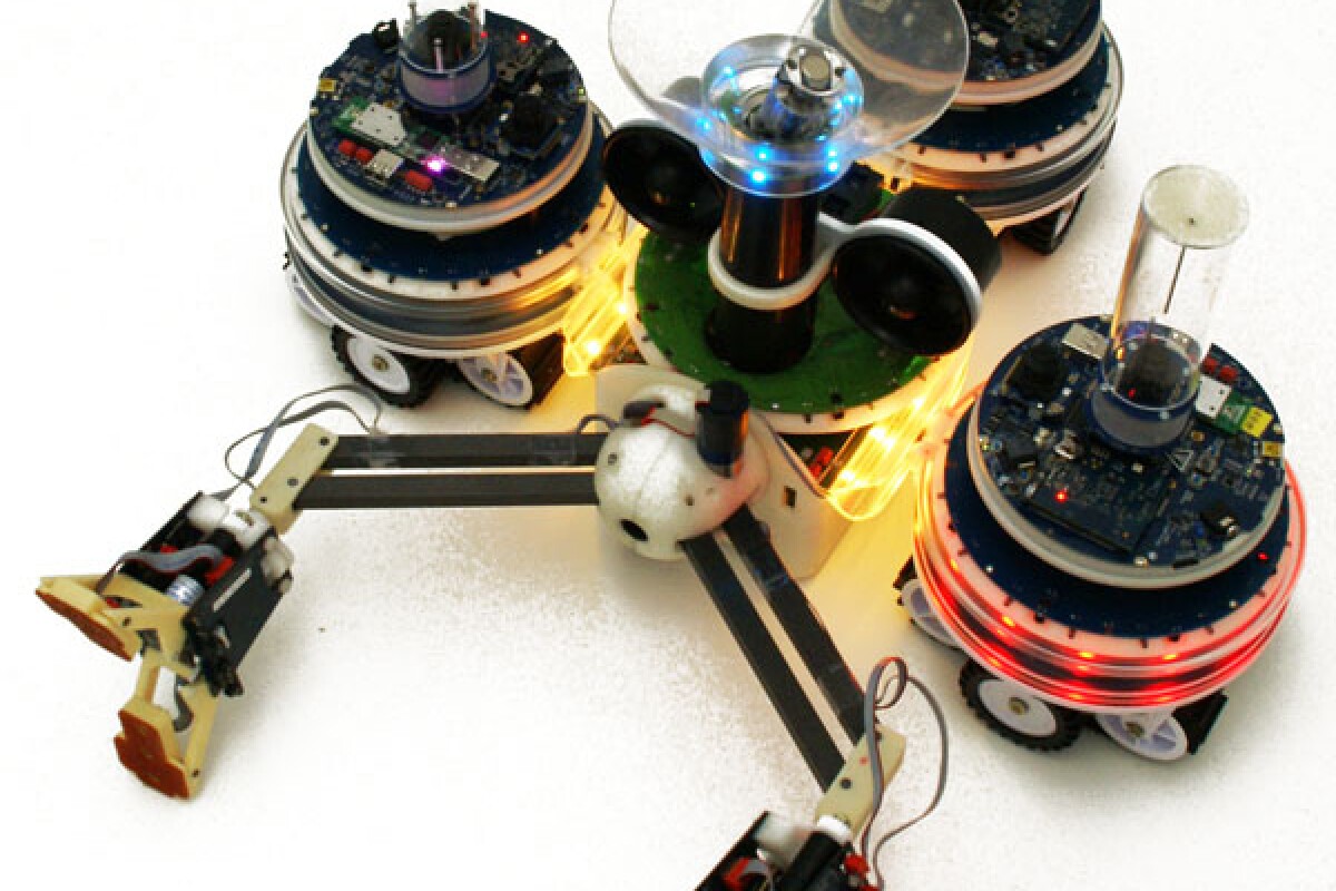 A Swarmanoid Hand-Bot, with three Foot-Bots