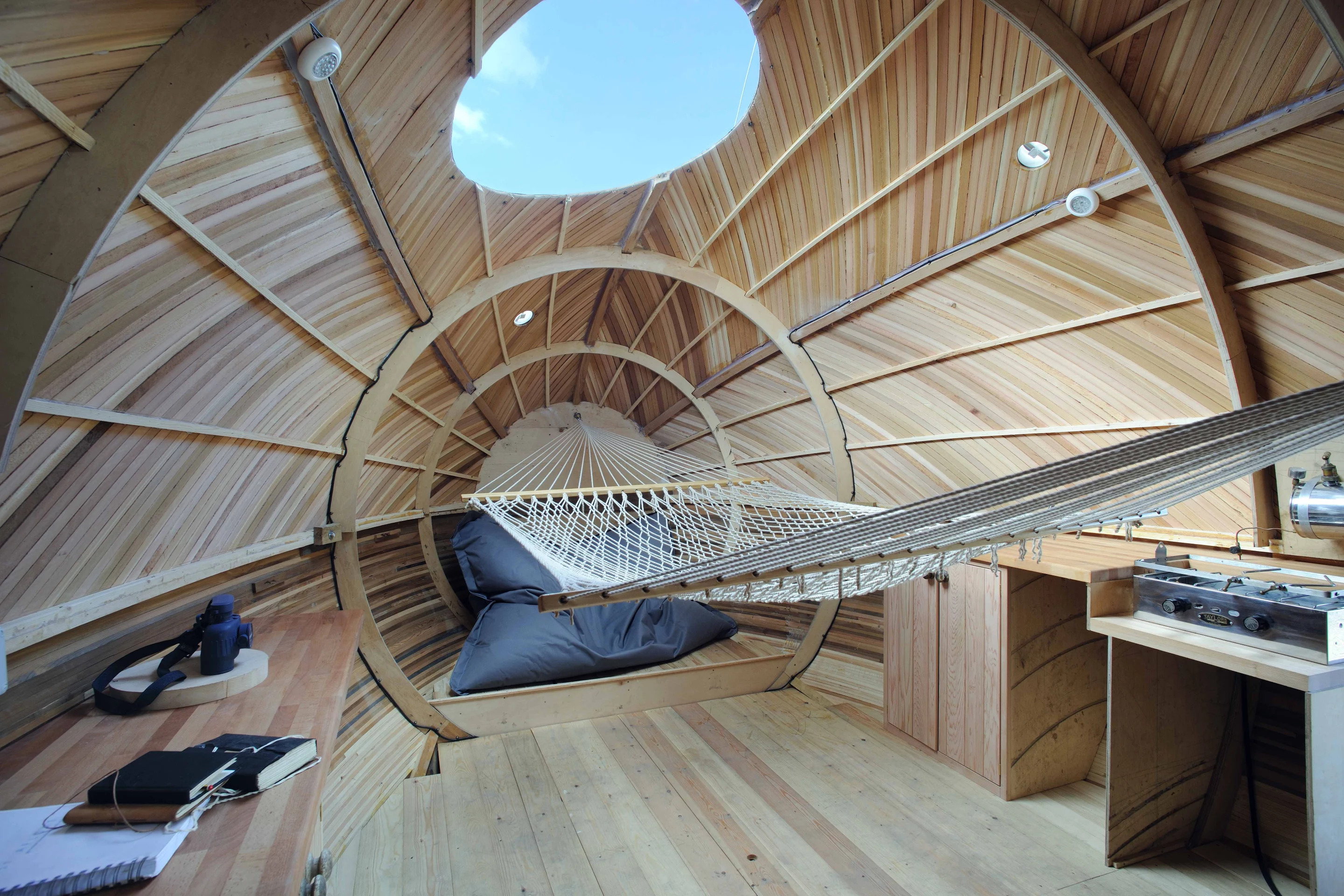 The interior contains a desk area, hammock, and kitchen, which itself sports a paraffin stove and sink (Photo: Nigel Rigden)