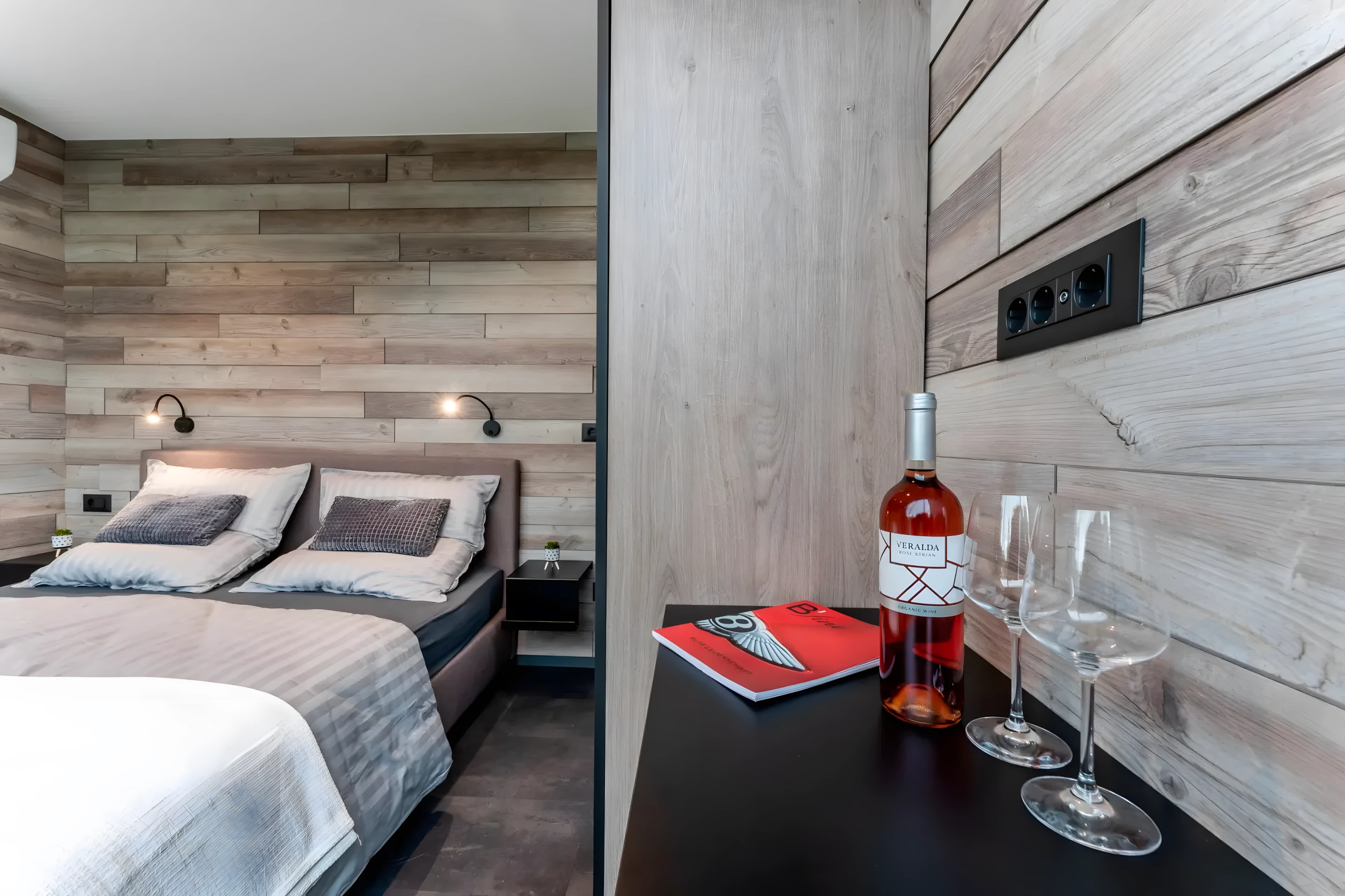 The DQ Tower's master bedroom includes a large wardrobe and a desk/dressing table
