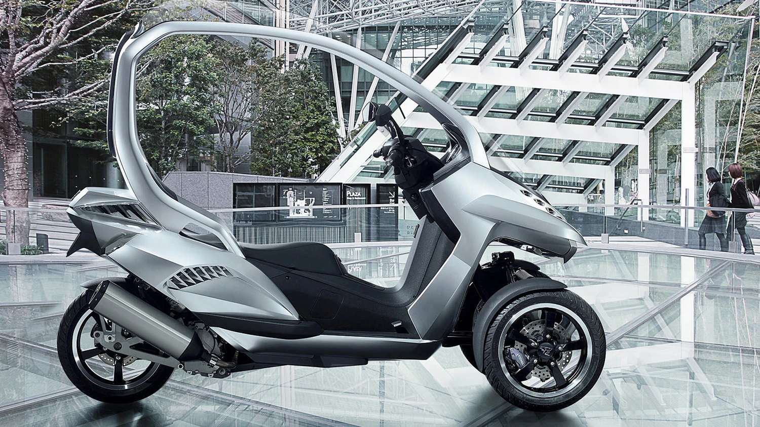 Peugeot's three wheeler has a supercharged 125cc motor and two front wheel electric motors