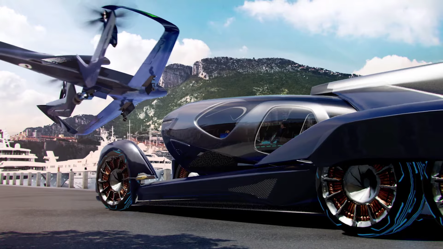 The airframe drops the passenger pod off onto a self-driving electric car chassis for relatively seamless last-mile transport