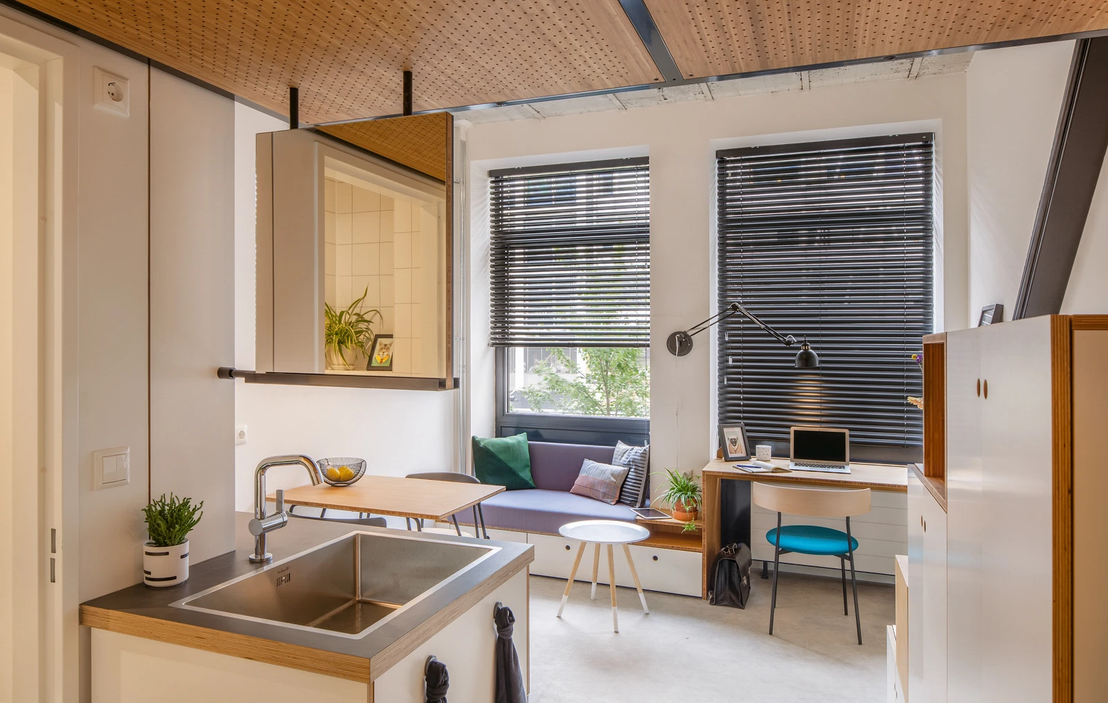 The Hermes City Plaza apartments feature a sink that serves both bathroom and kitchen