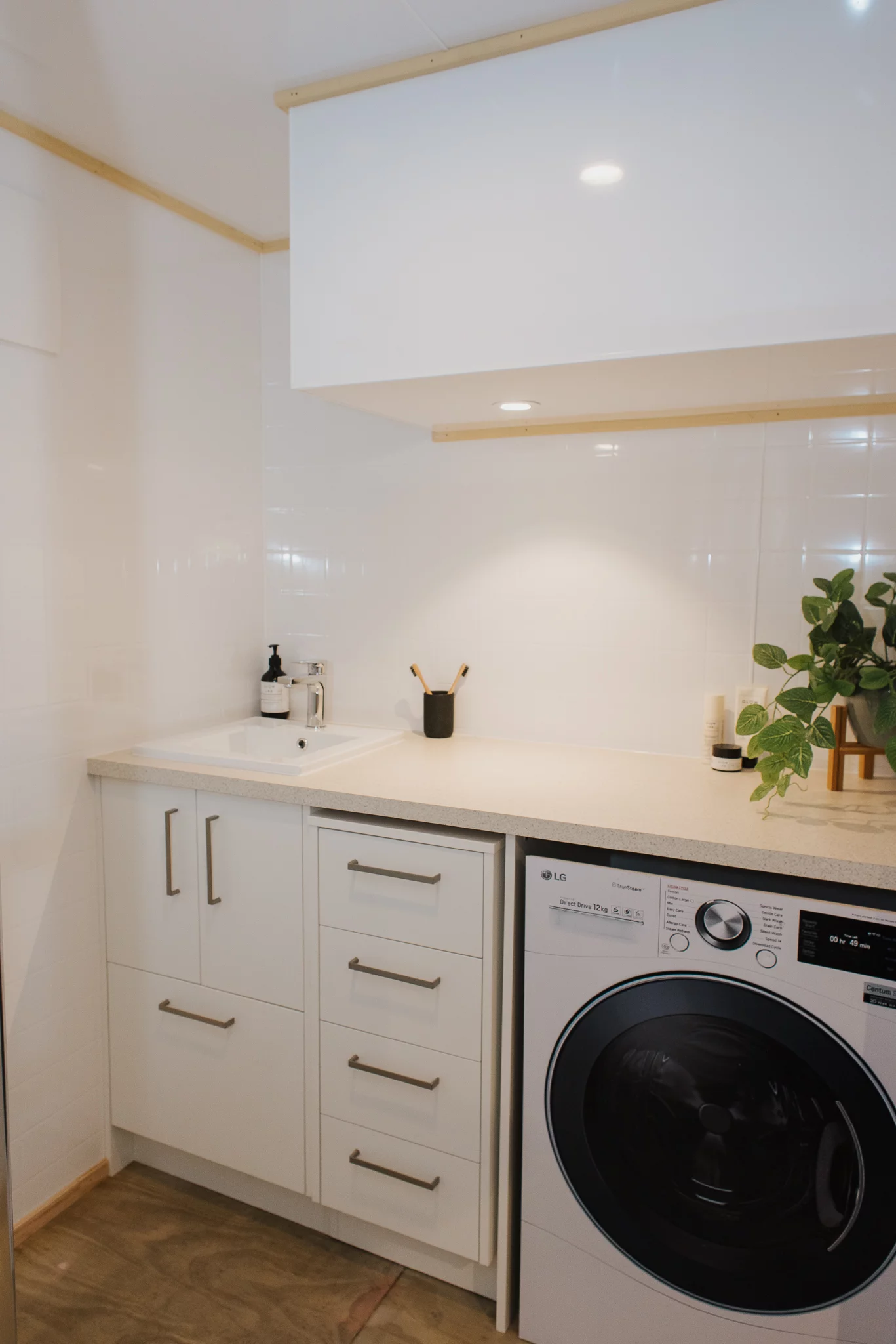 The Total Grace's bathroom includes a washer/dryer