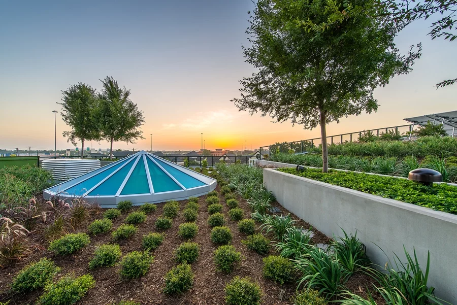 The building features a green roof that includes a rooftop garden and a means of collecting rainwater