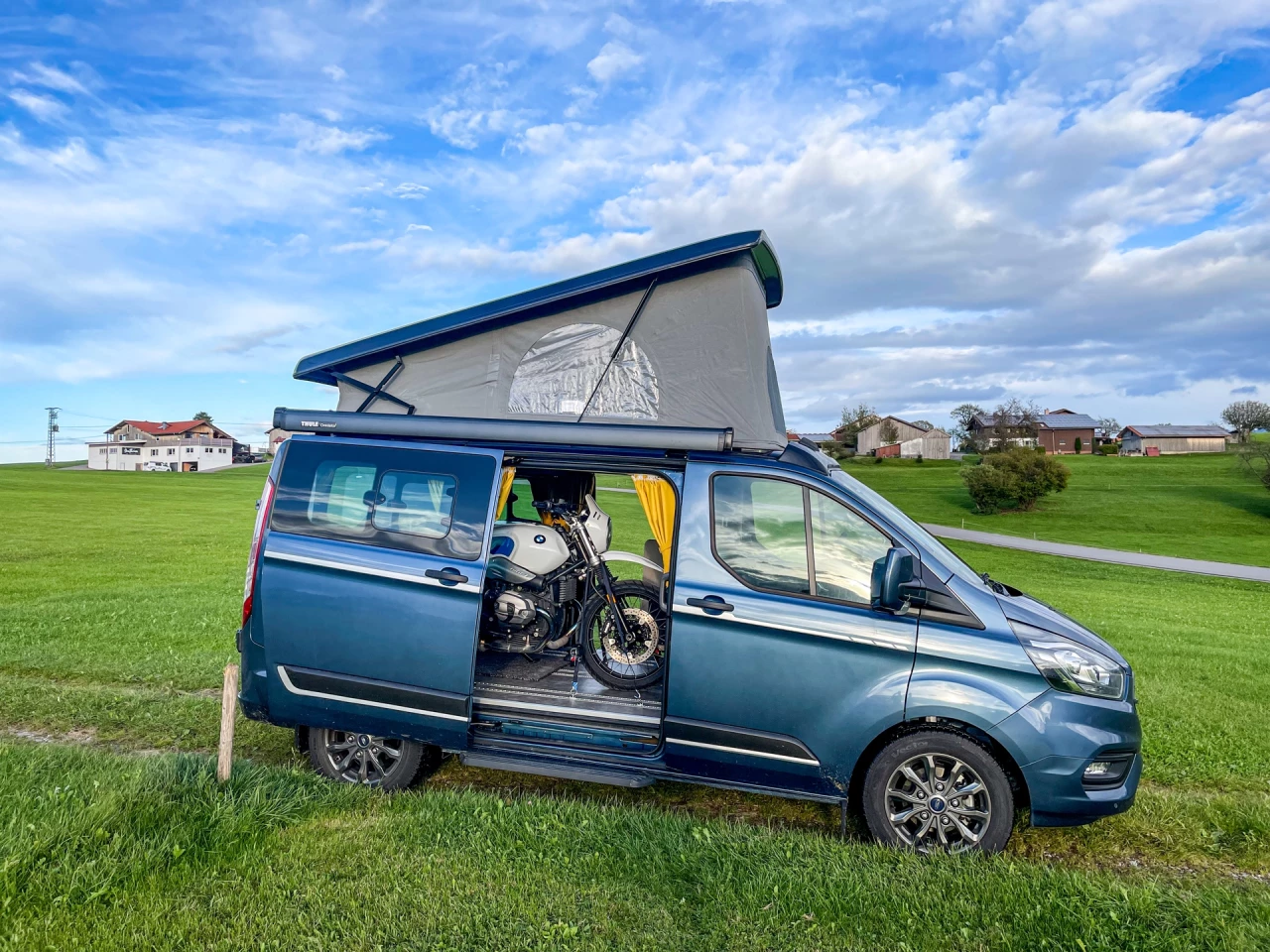 The Southvan Allrounder mini-camper is smaller than the typical moto-hauling camper van, but it looks to work for two people exploring via van and bike