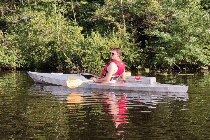 Brennen Kunka in his homebuilt all-aluminum kayak